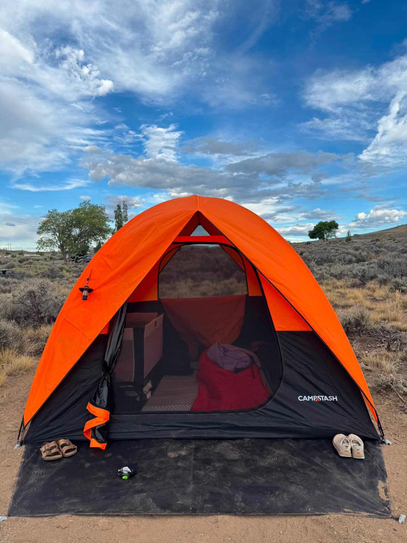 Campstash Tent beneath a wide blue sky at a Colorado campsite