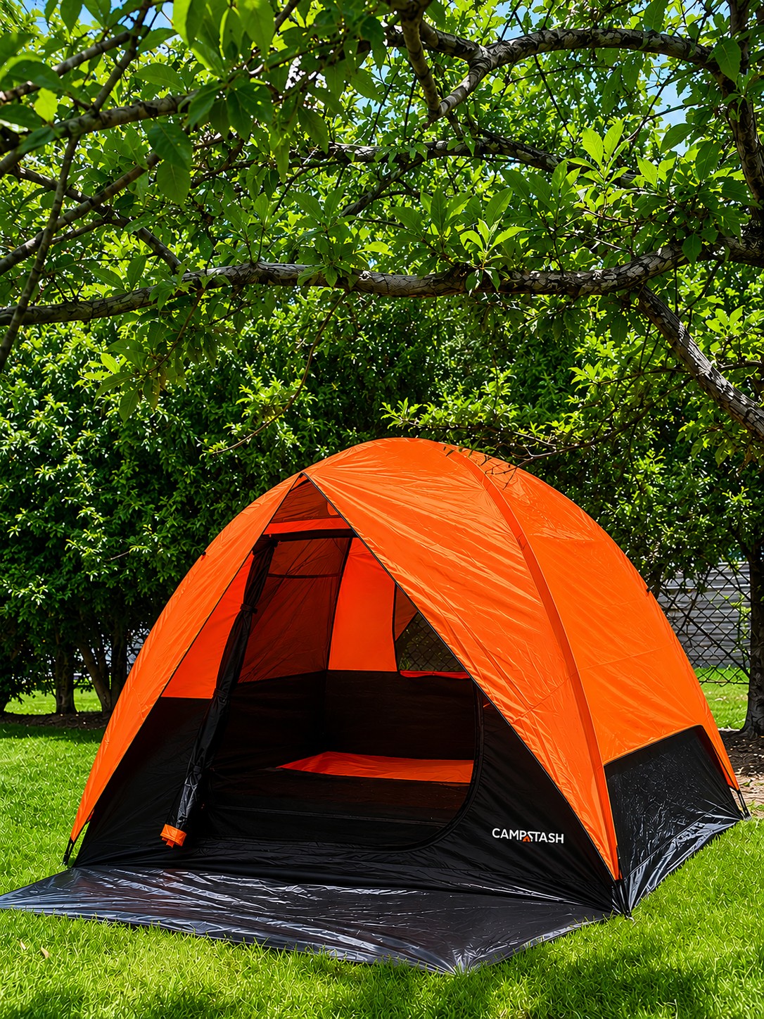 Campstash Tent at a customer campsite beneath green trees